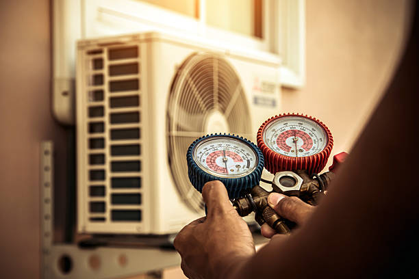 Professional Air Conditioning Service technician working in Piedmont, AL